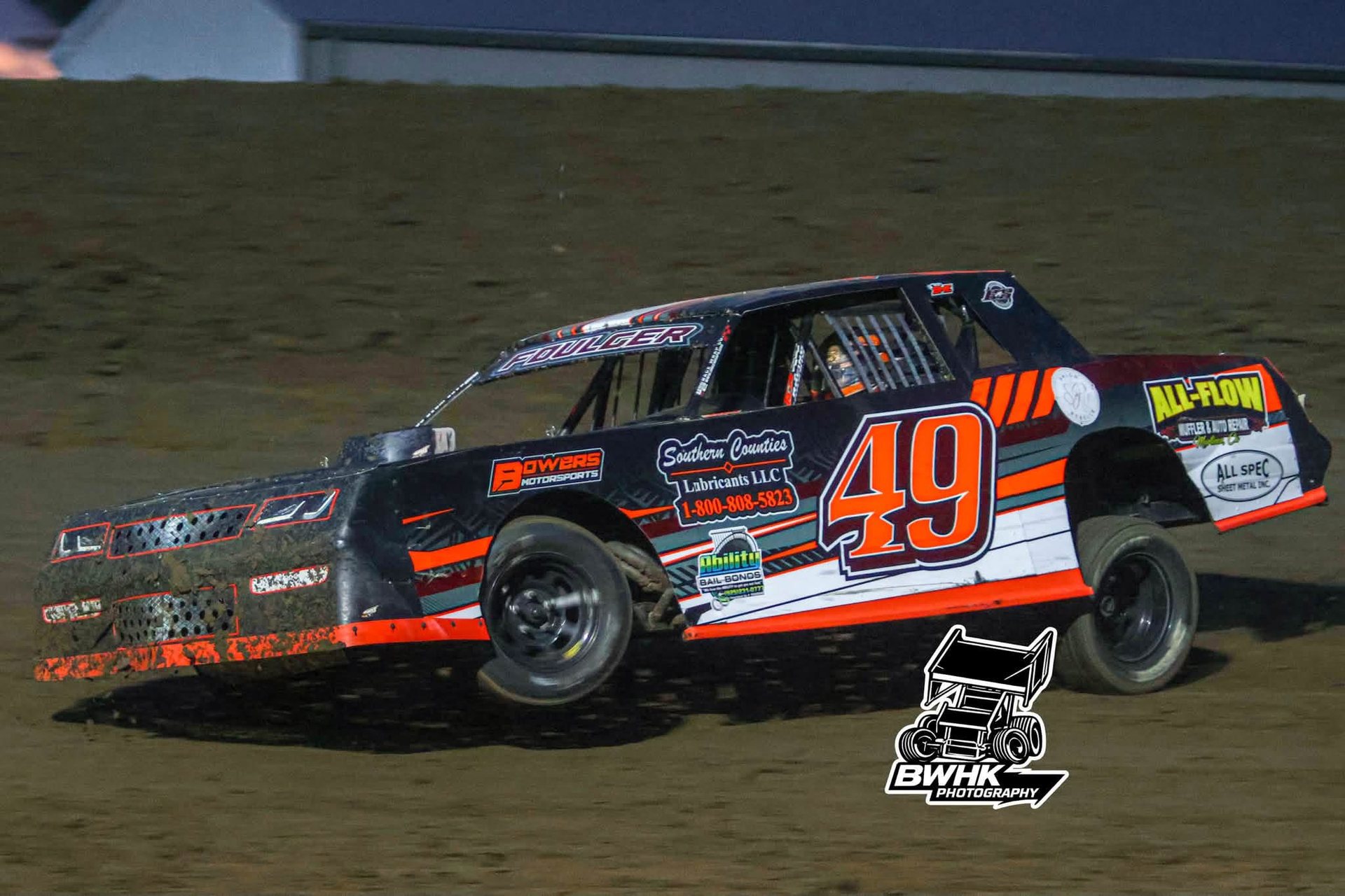 No. 49 car leaned hard through a muddy corner