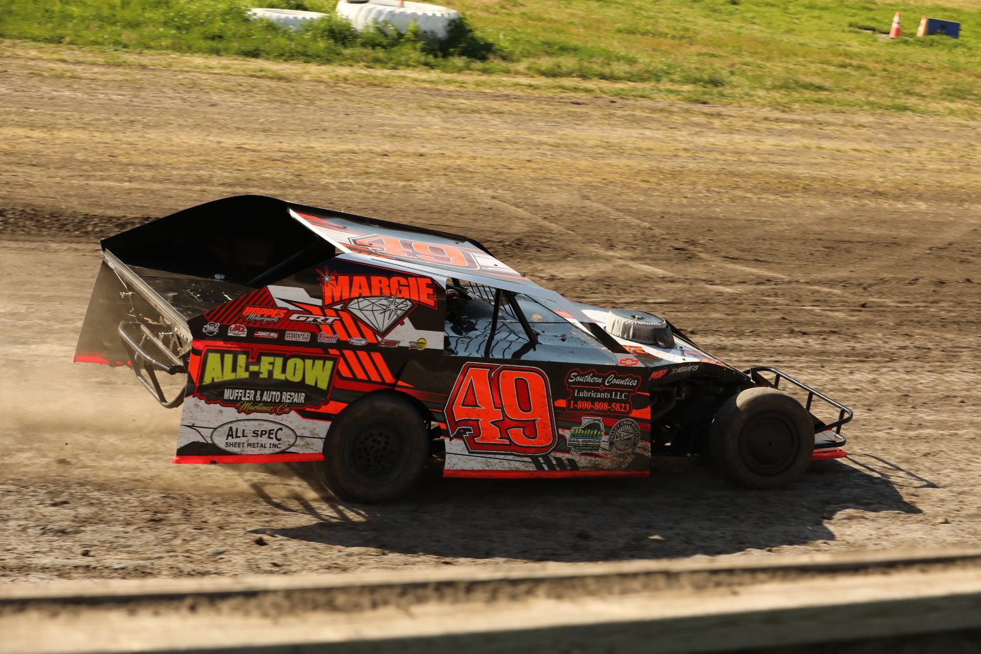 No. 49 car in daylight showing the Margie and All-Flow sponsor livery
