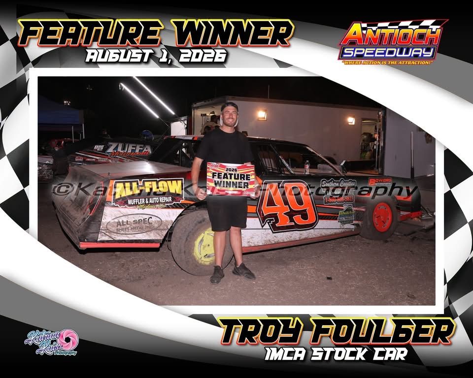 Troy Foulger holding the feature winner sign in victory lane, August 1, 2026